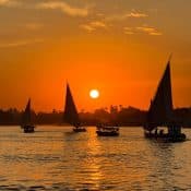 Enjoy a relaxing Nile River boat trip to Banana Island in Luxor with beautiful scenery, fresh fruits, and stunning sunsets.