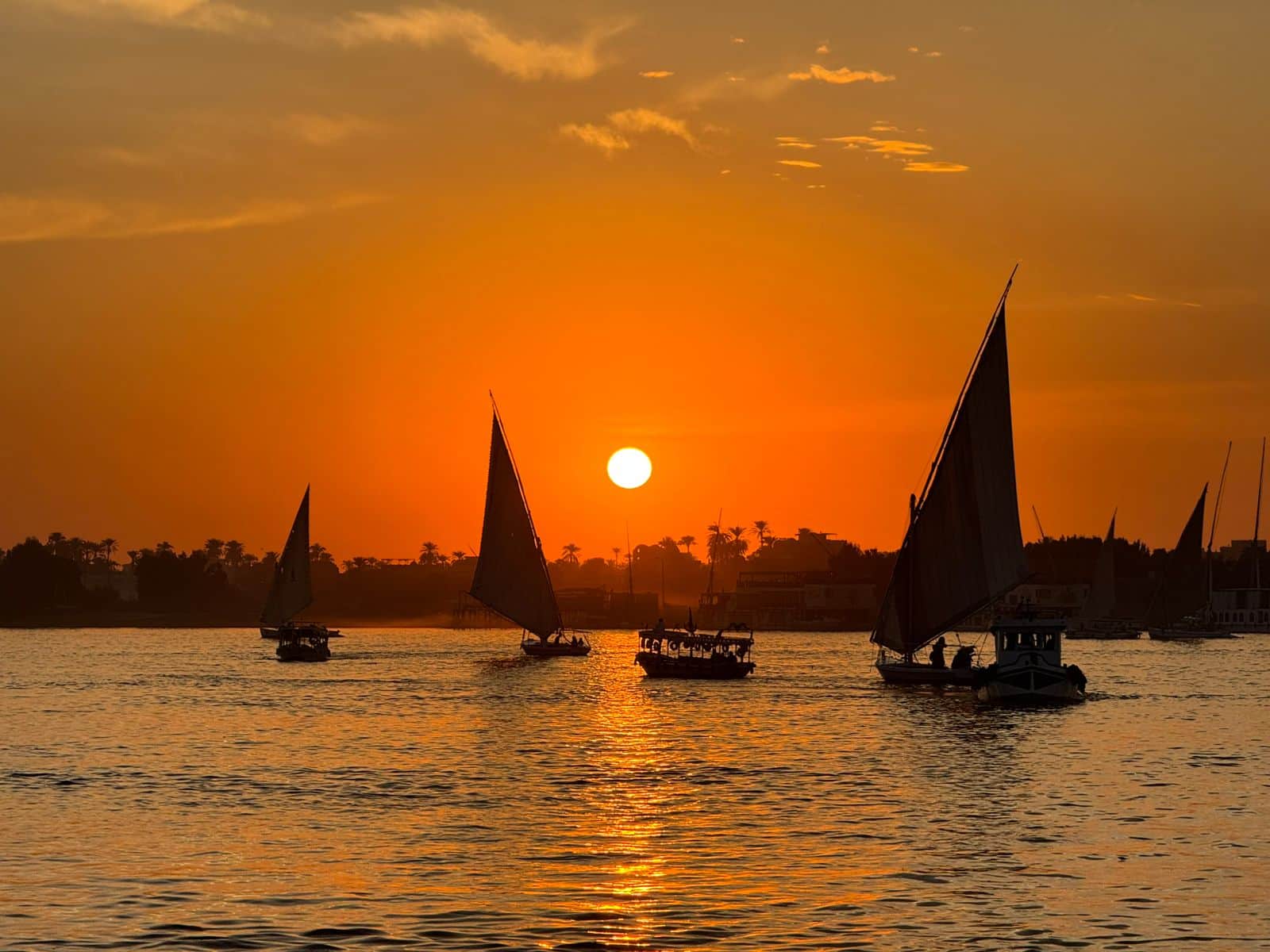 Enjoy a relaxing Nile River boat trip to Banana Island in Luxor with beautiful scenery, fresh fruits, and stunning sunsets.